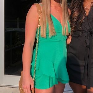Green romper with ruffles
